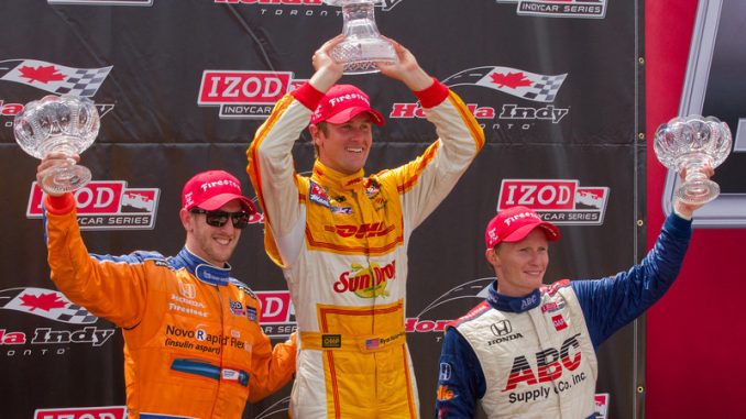 Ryan Hunter-Reay (centre), Charlie Kimball (left) and Mike Conway (right) stand on the podium at Honda Indy Toronto on Sunday afternoon (JP Dhanoa)